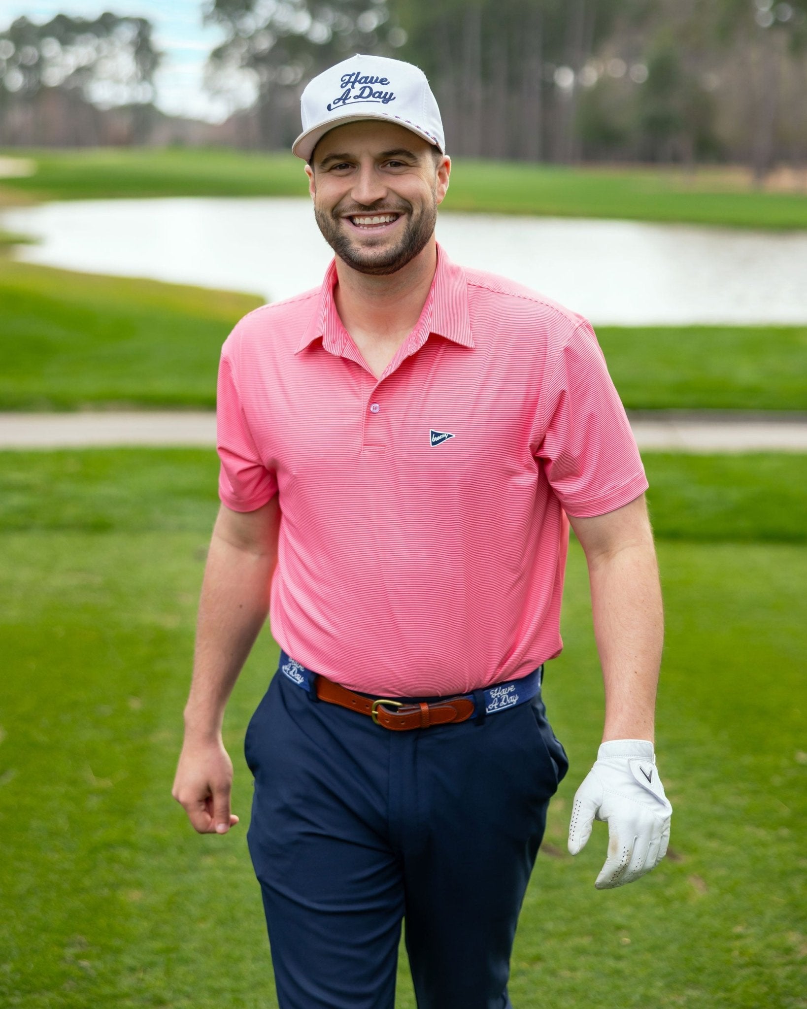 The Red & Pink Stripe Polo | Breezy Golf | Performance Golf Apparel