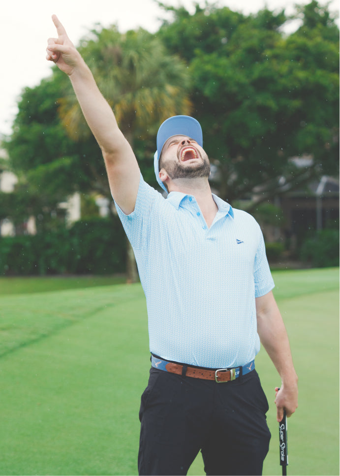 A golfer celebrating
